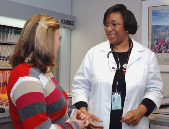 A primary care physician talking with a patient.